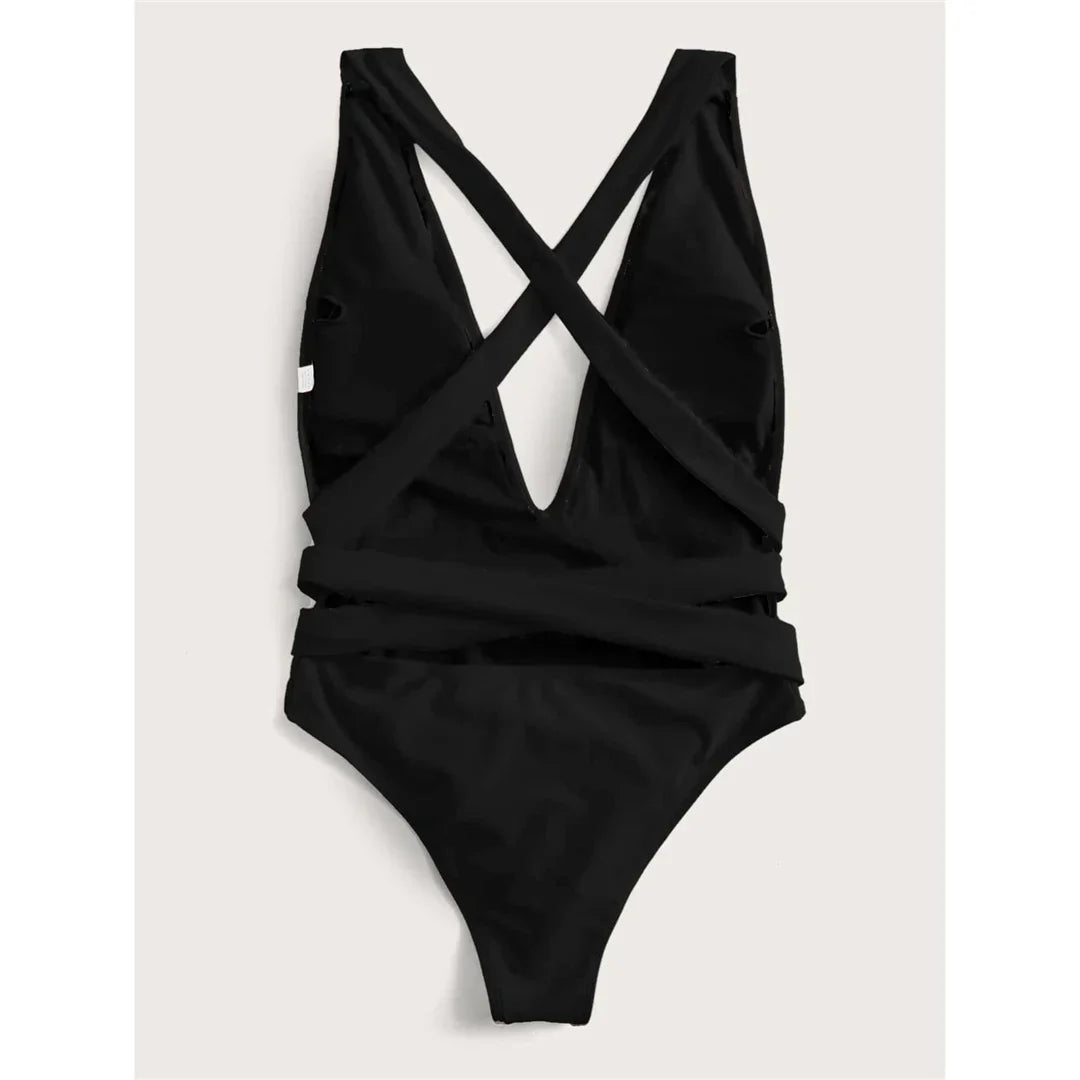 Maillot de bain une pièce triangle croisé noir posé à plat vu de dos, bretelles croisées et découpe large au centre