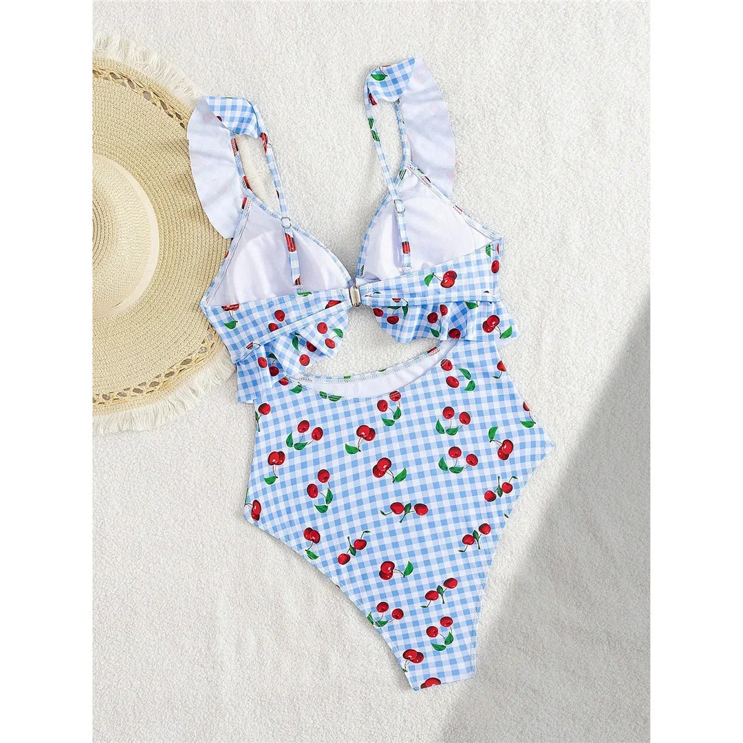 Maillot de bain une pièce à volants bleu clair à carreaux et cerises vu de dos, bretelles volantées et lien au dos